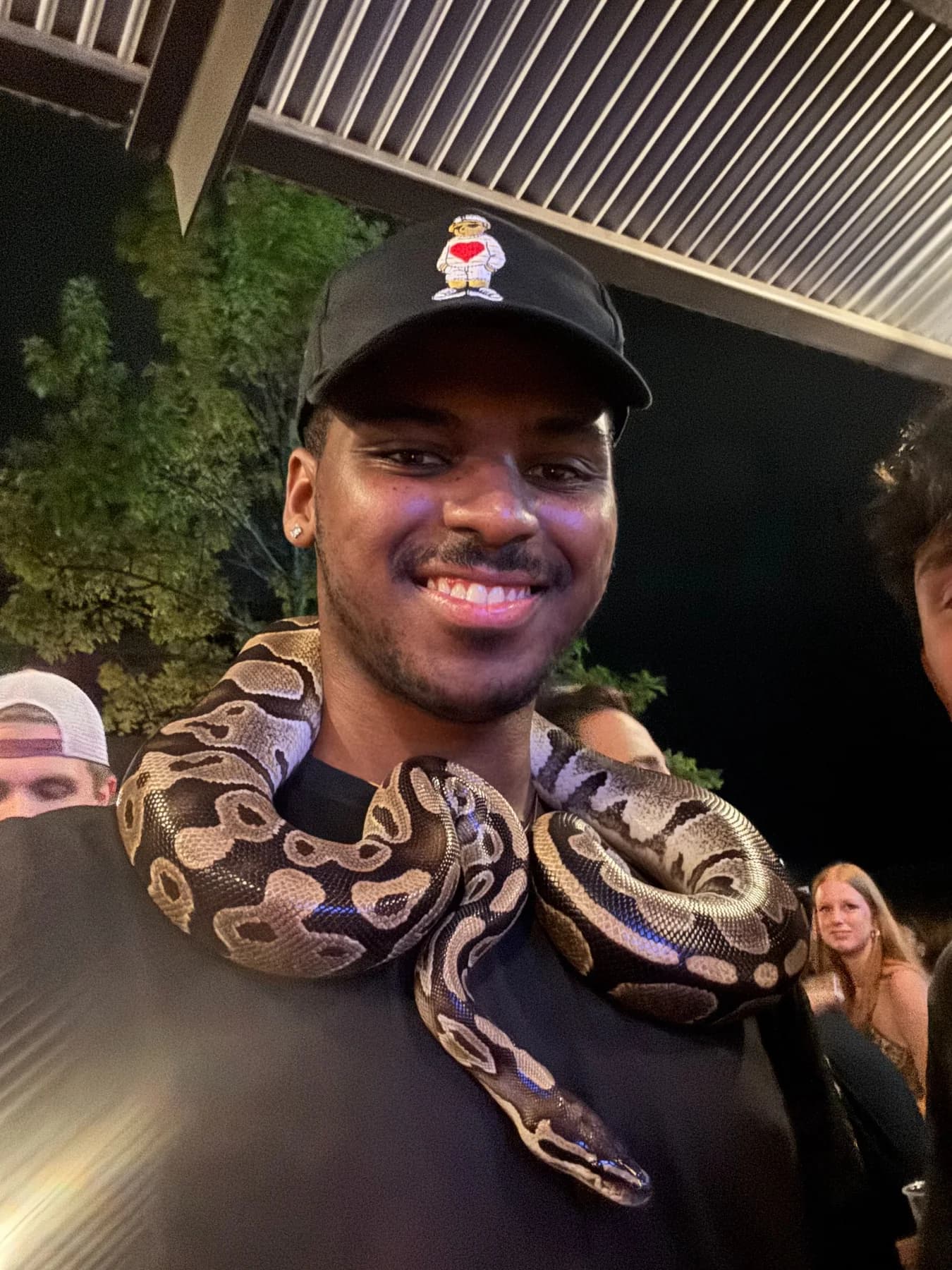 Holding a snake at an event